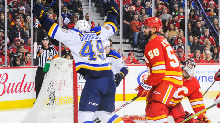 CALGARY, AB - DECEMBER 22: Ivan Barbashev #49 of the St Louis Blues celebrates after the shot of his teammate Oskar Sundqvist #70 flew past Mike Smith #41 of the Calgary Flames during an NHL game at Scotiabank Saddledome on December 22, 2018 in Calgary, Alberta, Canada. (Photo by Derek Leung/Getty Images)