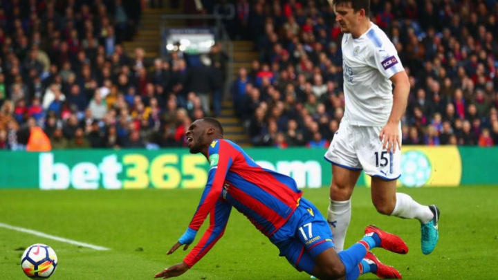 LONDON, ENGLAND - APRIL 28: Harry Maguire of Leicester City fouls Christian Benteke of Crystal Palace leading to a penalty during the Premier League match between Crystal Palace and Leicester City at Selhurst Park on April 28, 2018 in London, England. (Photo by Clive Rose/Getty Images)