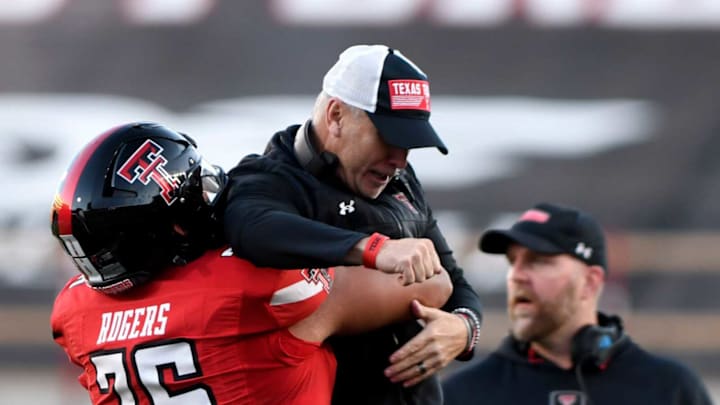 Texas Tech’s offensive lineman Caleb Rogers (76) lifts Texas Tech’s head coach Joey McGuire after Behren MortonÕs touchdown against TCU in a Big 12 football game, Thursday, Nov. 2, 2023, at Jones AT&T Stadium.