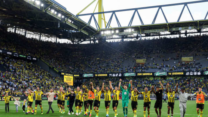 Borussia Dortmund players celebrate after the final whistle (Photo by Marcel ter Bals/Orange Pictures/BSR Agency/Getty Images)