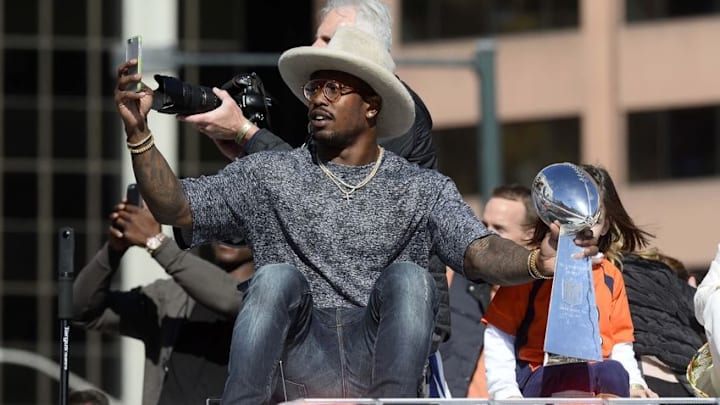 Feb 9, 2016; Denver, CO, USA; Denver Broncos outside linebacker Von Miller (58) holds the Vince Lombardi Trophy during the Super Bowl 50 championship parade at Civic Center Park. Mandatory Credit: Ron Chenoy-USA TODAY Sports