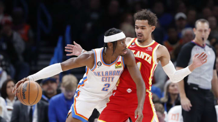 Shai Gilgeous-Alexander (2) dribbles the ball against Atlanta Hawks guard Trae Young (11) Alonzo Adams-USA TODAY Sports