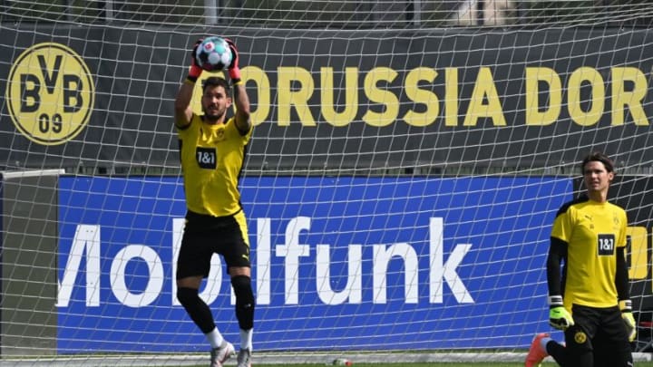 Borussia Dortmunds goalkeepers Roman Burki and Marwin Hitz (R) attend a training session of the German first division Bundesliga team Borussia Dortmund at the team training grounds in Dortmund, western Germany, on August 3, 2020. (Photo by INA FASSBENDER / AFP) (Photo by INA FASSBENDER/AFP via Getty Images)
