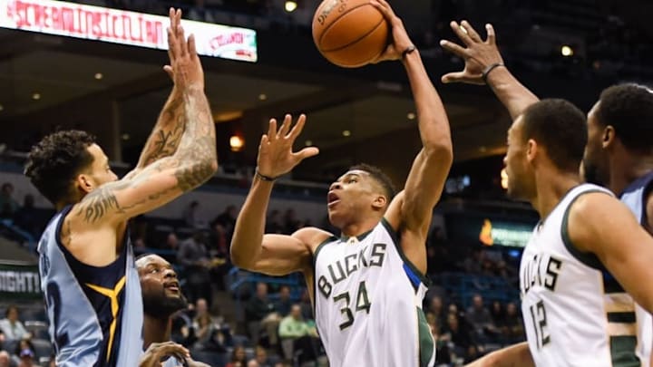 Mar 17, 2016; Milwaukee, WI, USA; Milwaukee Bucks forward Giannis Antetokounmpo (34) takes a shot against Memphis Grizzlies forward Matt Barnes (22) in the third quarter at BMO Harris Bradley Center. Mandatory Credit: Benny Sieu-USA TODAY Sports