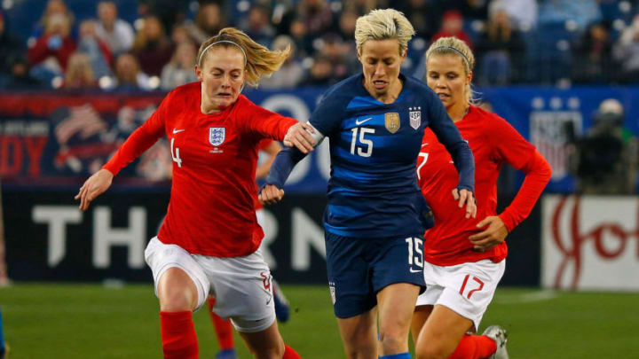 NASHVILLE, TN - MARCH 02: Keira Walsh #4 of England and Megan Rapinoe #15 of the USA chase a ball during the second half of the 2019 SheBelieves Cup match between USA and England at Nissan Stadium on March 2, 2019 in Nashville, Tennessee. (Photo by Frederick Breedon/Getty Images)