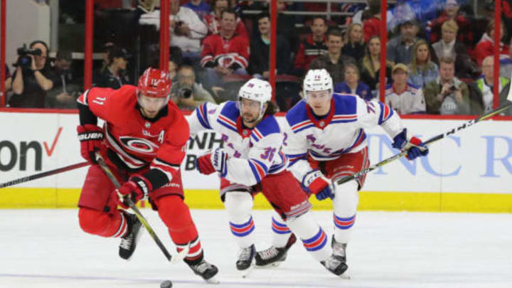 RALEIGH, NC – MARCH 31: Carolina Hurricanes Center Jordan Staal (11) goes for the puck with New York Rangers Right Wing Mats Zuccarello (36) closely behind during the 2nd period of the Carolina Hurricanes game versus the New York Rangers on March 31, 2018, at PNC Arena (Photo by Jaylynn Nash/Icon Sportswire via Getty Images)