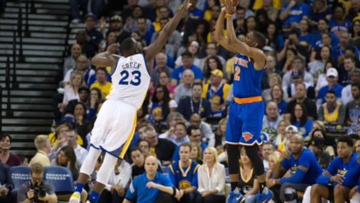 Mar 16, 2016; Oakland, CA, USA; New York Knicks guard Langston Galloway (2) scores a basket against Golden State Warriors forward Draymond Green (23) during the third quarter at Oracle Arena. The Warriors defeated the Knicks 121-85. Mandatory Credit: Kelley L Cox-USA TODAY Sports