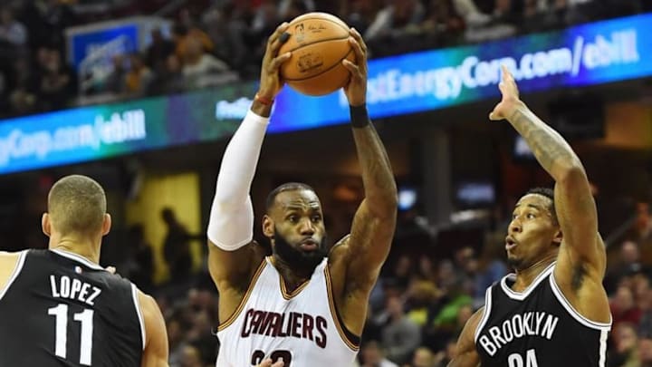 Dec 23, 2016; Cleveland, OH, USA; Cleveland Cavaliers forward LeBron James (23) drives to the basket between Brooklyn Nets center Brook Lopez (11) and forward Rondae Hollis-Jefferson (24) during the first half at Quicken Loans Arena. Mandatory Credit: Ken Blaze-USA TODAY Sports
