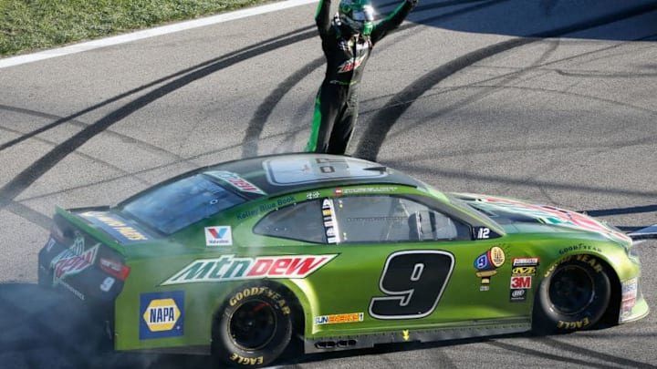 KANSAS CITY, KS - OCTOBER 21: Chase Elliott, driver of the #9 Mountain Dew Chevrolet, celebrates after winning the Monster Energy NASCAR Cup Series Hollywood Casino 400 at Kansas Speedway on October 21, 2018 in Kansas City, Kansas. (Photo by Jonathan Ferrey/Getty Images)
