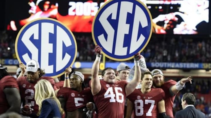 Dec 5, 2015; Atlanta, GA, USA; Alabama Crimson Tide tight end Michael Nysewander (46) celebrates with teammates after defeating the Florida Gators in the 2015 SEC Championship Game at the Georgia Dome. Alabama won 29-15. Mandatory Credit: John David Mercer-USA TODAY Sports