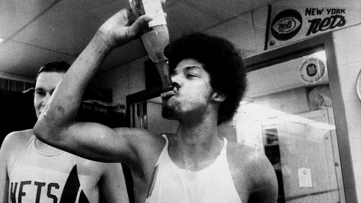 UNITED STATES – MAY 12: New York Nets win ABA Championship! It’s just what the doctor ordered, and Julius Erving relishes every drop of champagne. The ABA’s most valuable player scored ‘only’ 20, but grabbed 16 rebounds. (Photo by Dan Farrell/NY Daily News Archive via Getty Images)