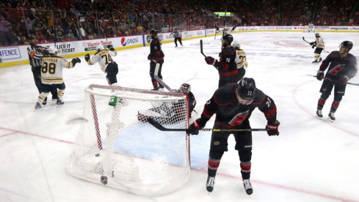 RALEIGH, NORTH CAROLINA - MAY 14: Jake DeBrusk #74 of the Boston Bruins reacts after colliding with Curtis McElhinney #35 of the Carolina Hurricanes which causes a disallowed Boston Bruins goal during the third period in Game Three of the Eastern Conference Finals during the 2019 NHL Stanley Cup Playoffs at PNC Arena on May 14, 2019 in Raleigh, North Carolina. (Photo by Bruce Bennett/Getty Images)