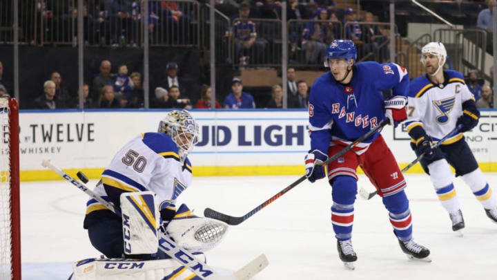NEW YORK, NEW YORK - MARCH 03: Jordan Binnington #50 of the St. Louis Blues makes a save against Ryan Strome #16 of the New York Rangers during their game at Madison Square Garden on March 03, 2020 in New York City. (Photo by Al Bello/Getty Images)