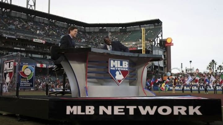 Mar 17, 2013; San Francisco, CA, USA; MLB Network sportscasters Bob Costas (left) and Harold Reynolds (right) before the game between Japan and Puerto Rico during the World Baseball Classic semifinal at AT&T Park. Mandatory Credit: Kelley L Cox-USA TODAY Sports