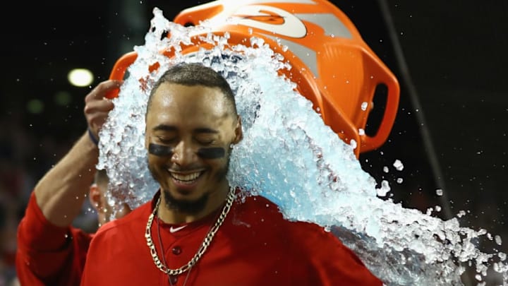 MLB Draft DFS Picks: BOSTON, MA - JULY 27: Mookie Betts #50 of the Boston Red Sox recieves a Gatorade bath from J.D. Martinez #28 of the Boston Red Sox after hitting a walk off home in the bottom of the tenth inning of the game against the Minnesota Twins at Fenway Park on July 27, 2018 in Boston, Massachusetts. (Photo by Omar Rawlings/Getty Images)