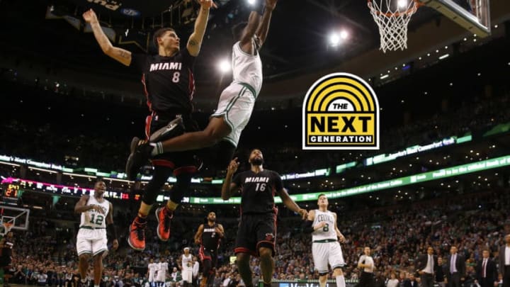 Dec 30, 2016; Boston, MA, USA; Boston Celtics forward Jaylen Brown (7) soars past Miami Heat guard Tyler Johnson (8) for a dunk during the second half at TD Garden. Mandatory Credit: Winslow Townson-USA TODAY Sports