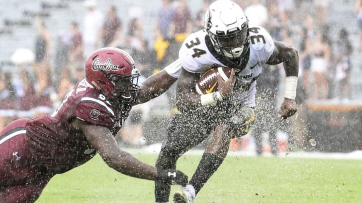 COLUMBIA, SC - OCTOBER 06: Running back Larry Rountree III #34 of the Missouri Tigers evades defensive lineman Rick Sandidge #90 of the South Carolina Gamecocks during the football game at Williams-Brice Stadium on October 6, 2018 in Columbia, South Carolina. (Photo by Mike Comer/Getty Images)