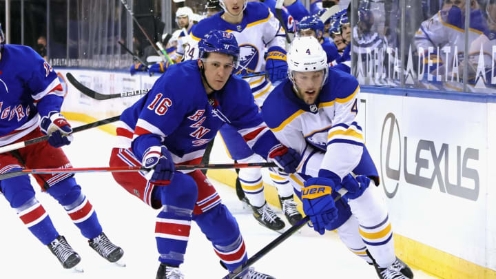 NEW YORK, NEW YORK – MARCH 22: Taylor Hall #4 of the Buffalo Sabres skates past Ryan Strome #16 of the New York Rangers at Madison Square Garden on March 22, 2021 in New York City. (Photo by Bruce Bennett/Getty Images)