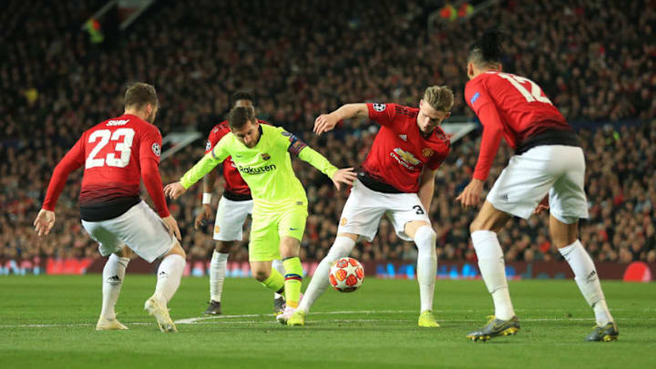 MANCHESTER, ENGLAND - APRIL 10: Lionel Messi of Barcelona battles with Scott McTominay of Man Utd during the UEFA Champions League Quarter Final first leg match between Manchester United and FC Barcelona at Old Trafford on April 10, 2019 in Manchester, England. (Photo by Simon Stacpoole/Offside/Getty Images)