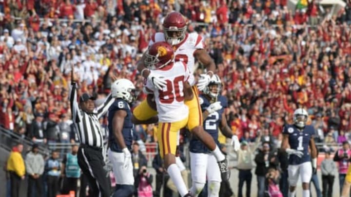 Jan 2, 2017; Pasadena, CA, USA; USC Trojans wide receiver Deontay Burnett (80) celebrates with tight end Daniel Imatorbhebhe (88) a after scoring on a 3-yard touchdown pass in the second quarter against the Penn State Nittany Lions during the 103rd Rose Bowl at Rose Bowl. USC defeated Penn State 52-49 in the highest scoring game in Rose Bowl history. Mandatory Credit: Kirby Lee-USA TODAY Sports