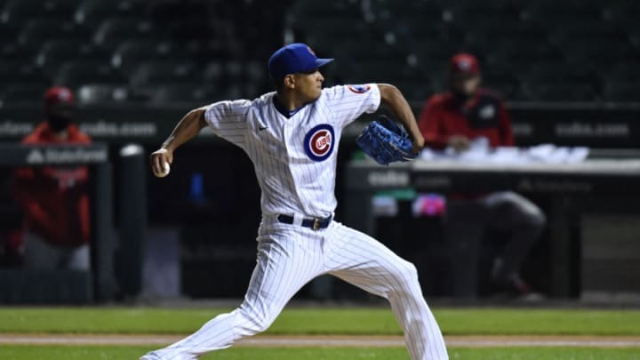 CHICAGO, ILLINOIS - SEPTEMBER 10: Starting pitcher Adbert Alzolay #73 of the Chicago Cubs throws the baseball in the first inning against the Cincinnati Redsat Wrigley Field on September 10, 2020 in Chicago, Illinois. (Photo by Quinn Harris/Getty Images)