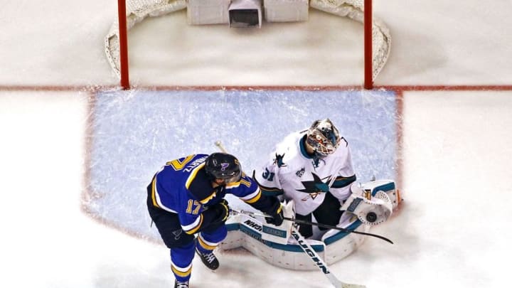 May 17, 2016; St. Louis, MO, USA; San Jose Sharks goalie Martin Jones (31) makes a glove save on a shot that is deflected by St. Louis Blues left wing Jaden Schwartz (17) during the second period in game two of the Western Conference Final of the 2016 Stanley Cup Playoff at Scottrade Center. The Sharks won the game 4-0. Mandatory Credit: Billy Hurst-USA TODAY Sports