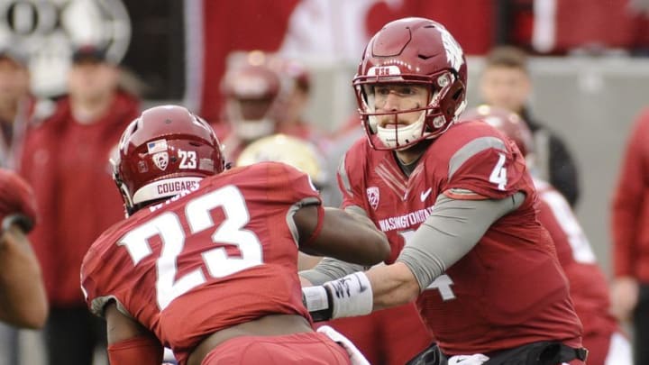 Nov 25, 2016; Pullman, WA, USA; Washington State Cougars running back Gerard Wicks (23) takes the hand off from Washington State Cougars quarterback Luke Falk (4) during a game against the Washington Huskies during the second at Martin Stadium. The Huskies won 45-17. Mandatory Credit: James Snook-USA TODAY Sports