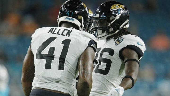 MIAMI, FLORIDA - AUGUST 22: Josh Allen #41 and Ronnie Harrison #36 of the Jacksonville Jaguars celebrate against the Miami Dolphins during the preseason game at Hard Rock Stadium on August 22, 2019 in Miami, Florida. (Photo by Michael Reaves/Getty Images)