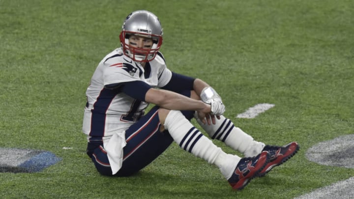 MINNEAPOLIS, MN - FEBRUARY 04: Tom Brady #12 of the New England Patriots sits on the field an looks on after a play against the Philadelphia Eagles during Super Bowl LII at U.S. Bank Stadium on February 4, 2018 in Minneapolis, Minnesota. The Eagles defeated the Patriots 41-33. (Photo by Focus on Sport/Getty Images) *** Local Caption *** Tom Brady