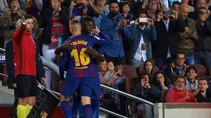 BARCELONA, SPAIN - SEPTEMBER 09: Ousmane Dembele of Barcelona embrances with substitute Gerard Deulofeu of Barcelona during the La Liga match between Barcelona and Espanyol at Camp Nou on September 9, 2017 in Barcelona, Spain. (Photo by Manuel Queimadelos Alonso/Getty Images)