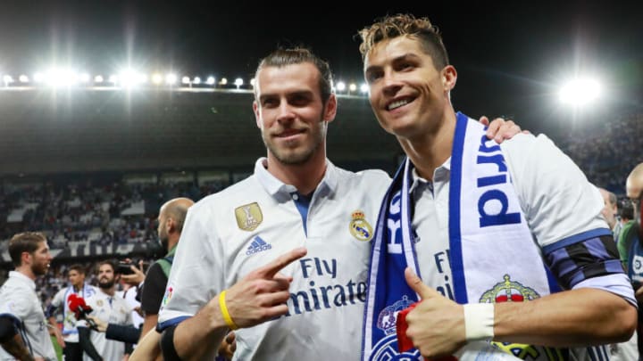 MALAGA, SPAIN - MAY 21: Cristiano Ronaldo of Real Madrid and Gareth Bale of Real Madrid celebrate after their team are crowned champions following the La Liga match between Malaga and Real Madrid at La Rosaleda Stadium on May 21, 2017 in Malaga, Spain. (Photo by Gonzalo Arroyo Moreno/Getty Images)