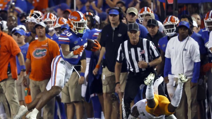 Sep 25, 2021; Gainesville, Florida, USA; Florida Gators running back Malik Davis (20) runs with the ball against the Tennessee Volunteers during the fourth quarter at Ben Hill Griffin Stadium. Mandatory Credit: Kim Klement-USA TODAY Sports