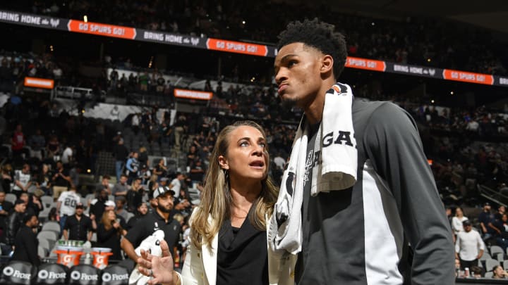 SAN ANTONIO, TX – OCTOBER 23: Becky Hammon and Dejounte Murray #5 of the San Antonio Spurs talk as they walk off the court after the game against the New York Knicks on October 23, 2019 at the AT&T Center in San Antonio, Texas. NOTE TO USER: User expressly acknowledges and agrees that, by downloading and or using this photograph, user is consenting to the terms and conditions of the Getty Images License Agreement. Mandatory Copyright Notice: Copyright 2019 NBAE (Photos by Logan Riely/NBAE via Getty Images)