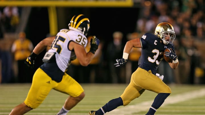 SOUTH BEND, IN – SEPTEMBER 06: Cam McDaniel #33 of the Notre Dame Fighting Irish is chased by Joe Bolden #35 of the Michigan Wolverines at Notre Dame Stadium on September 6, 2014 in South Bend, Indiana. (Photo by Jonathan Daniel/Getty Images)