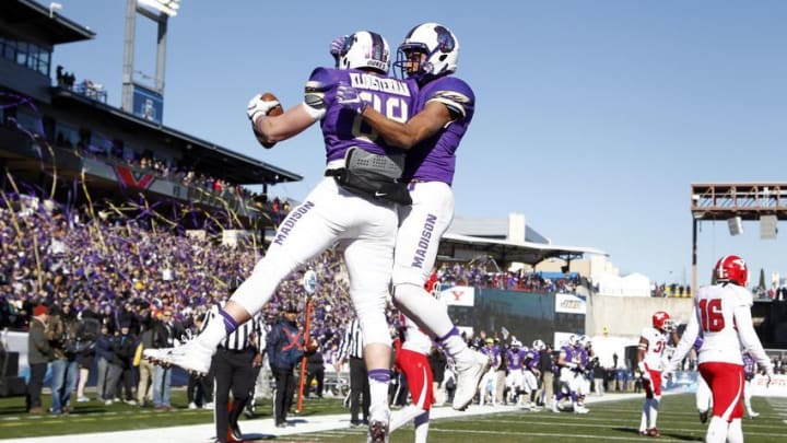 Jan 7, 2017; Frisco, TX, USA; James Madison Dukes tight end Jonathan Kloosterman (88) and wide receiver Brandon Ravenel (11) celebrate a touchdown in the first quarter against the Youngstown State Penguins in the D1 college football championship game at Toyota Stadium. Mandatory Credit: Tim Heitman-USA TODAY Sports