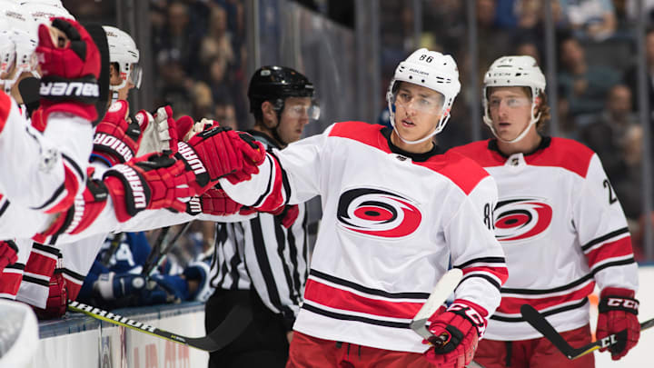 TORONTO, ON – OCTOBER 26: Teuvo Teravainen #86 of the Carolina Hurricanes is congratulated by his teammates after scoring on the Toronto Maple Leafs during the first period at the Air Canada Centre on October 26, 2017 in Toronto, Ontario, Canada. (Photo by Mark Blinch/NHLI via Getty Images)