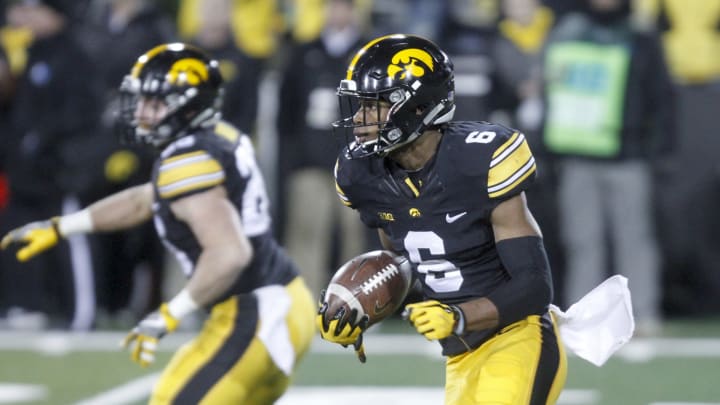 IOWA CITY, IOWA- NOVEMBER 18: Wide receiver Ihmir Smith-Marsette #6 of the Iowa Hawkeyes runs back a punt return during the fourth quarter against the Purdue Boilermakers on November 18, 2017 at Kinnick Stadium in Iowa City, Iowa. (Photo by Matthew Holst/Getty Images)