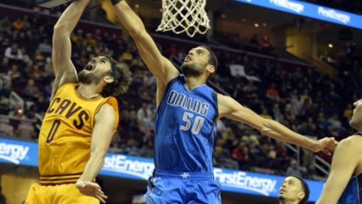 Oct 19, 2015; Cleveland, OH, USA; Cleveland Cavaliers forward Kevin Love (0) shoots as Dallas Mavericks center Salah Mejri (50) defends during the second quarter at Quicken Loans Arena. Mandatory Credit: Ken Blaze-USA TODAY Sports
