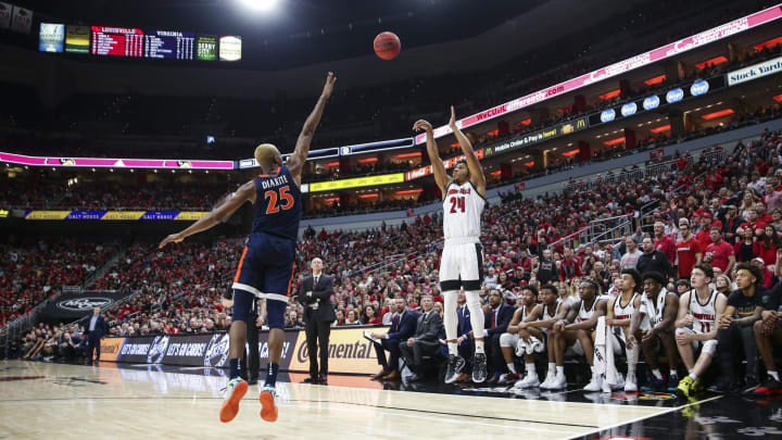 LOUISVILLE, KENTUCKY – FEBRUARY 08: Dwayne Sutton #24 of the Louisville Cardinals takes a three point shot while guarded by Mamadi Diakite #25 during the second half of the game at KFC YUM! Center on February 08, 2020 in Louisville, Kentucky. (Photo by Silas Walker/Getty Images)