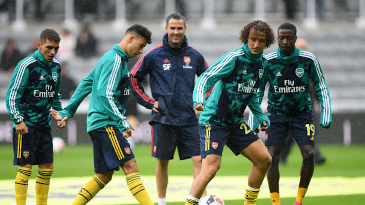 NEWCASTLE UPON TYNE, ENGLAND - AUGUST 11: David Luiz of Arsenal warms up with team mates Lucas Torreira, Gabriel Martinelli and Nicolas Pepe ahead of the Premier League match between Newcastle United and Arsenal FC at St. James Park on August 11, 2019 in Newcastle upon Tyne, United Kingdom. (Photo by Stu Forster/Getty Images)