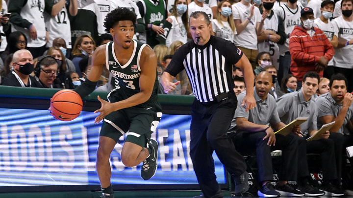 Nov 12, 2021; East Lansing, Michigan, USA; Michigan StateÕs Jaden Akins(3) drives down the sideline with a steal in the second half at Jack Breslin Student Events Center. Mandatory Credit: Dale Young-USA TODAY Sports