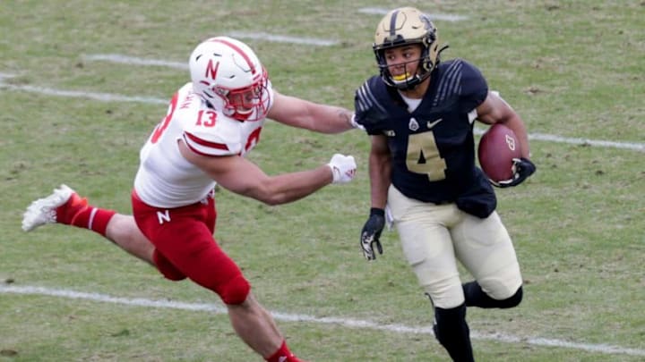 Purdue wide receiver Rondale Moore (4) runs the ball as Nebraska linebacker JoJo Domann (13) comes in for a tackle during the first quarter of an NCAA college football game, Saturday, Dec. 5, 2020 at Ross-Ade Stadium in West Lafayette.Cfb Purdue Vs Nebraska