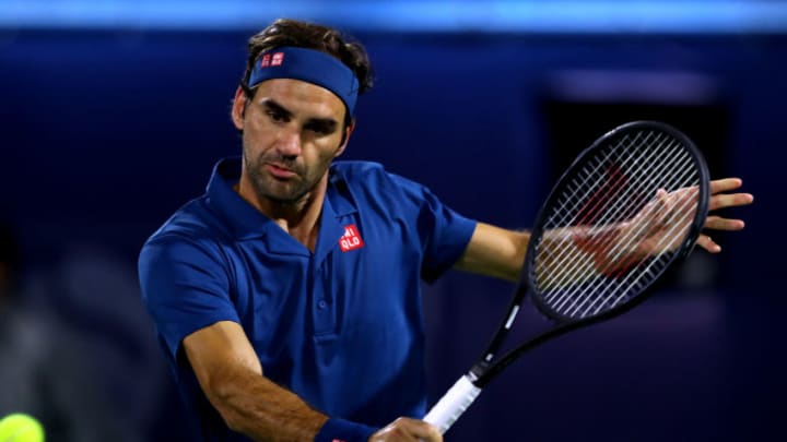 DUBAI, UNITED ARAB EMIRATES - FEBRUARY 28: Roger Federer of Switzerland plays a backhand against Marton Fucsovics of Hungary during day twelve of the ATP Dubai Duty Free Tennis Championships at Dubai Duty Free Tennis Stadium on February 28, 2019 in Dubai, United Arab Emirates. (Photo by Francois Nel/Getty Images)
