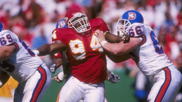 22 Sep 1996: Defensvie lineman Keith Traylor #94 of the Kansas City Chiefs stares into the back field as he uses his left arm to fight off an attempted block from offensive lineman Tom Walen #66 of the Denver Broncos while pursuing the football during a p