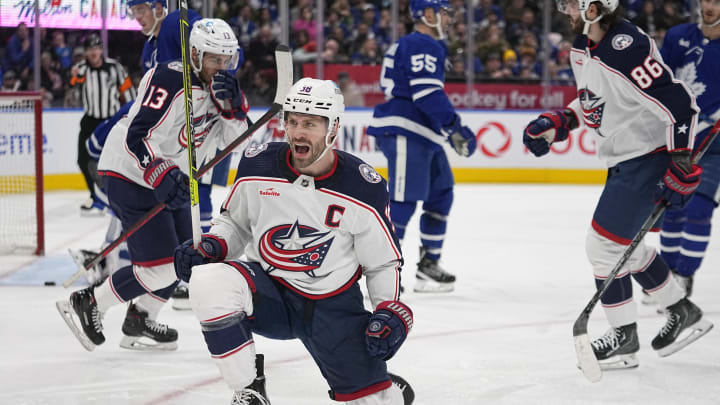 Feb 11, 2023; Toronto, Ontario, CAN; Columbus Blue Jackets forward Boone Jenner (38) celebrates his goal against the Toronto Maple Leafs during the second period at Scotiabank Arena. Mandatory Credit: John E. Sokolowski-USA TODAY Sports