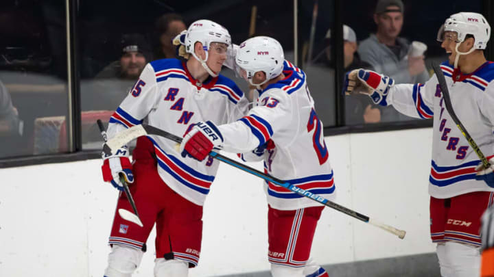 TRAVERSE CITY, MI - SEPTEMBER 09: Kaapo Kakko #45 of the New York Rangers celebrates his game winning O.T. goal against the Minnesota Wild with teammates Adam Fox #23 and Ryan Dmowski #58 during Day-4 of the NHL Prospects Tournament at Centre Ice Arena on September 9, 2019 in Traverse City, Michigan. The New York Rangers defeated the Minnesota Wild 4-3 in O.T. (Photo by Dave Reginek/NHLI via Getty Images)