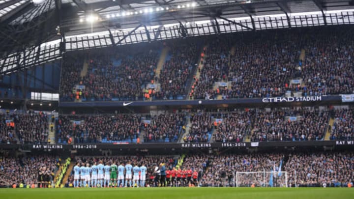 MANCHESTER, ENGLAND – APRIL 07: Fans, officials and players take part in a minute of applause for Ray Wilkins who passed away earlier in the week ahead of the Premier League match between Manchester City and Manchester United at Etihad Stadium on April 7, 2018 in Manchester, England. (Photo by Laurence Griffiths/Getty Images)