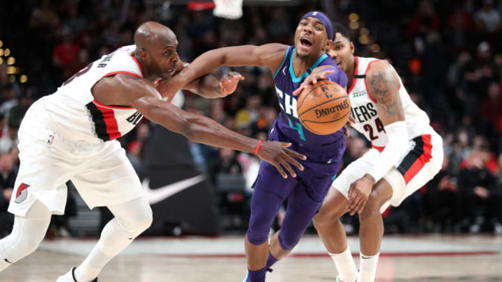 PORTLAND, OREGON - JANUARY 13: Devonte' Graham #4 of the Charlotte Hornets loses the ball against Anthony Tolliver #43 of the Portland Trail Blazers in the fourth quarter during their game at Moda Center on January 13, 2020 in Portland, Oregon. (Photo by Abbie Parr/Getty Images)