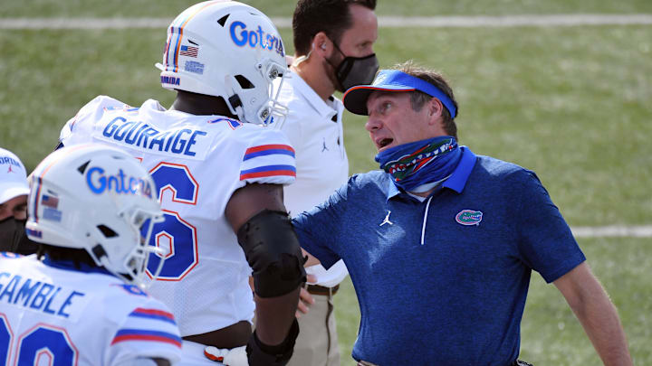 Nov 21, 2020; Nashville, Tennessee, USA; Florida Gators head coach Dan Mullen talks with Florida Gators offensive lineman Richard Gouraige (76) during the first half against the Vanderbilt Commodores at Vanderbilt Stadium. Mandatory Credit: Christopher Hanewinckel-USA TODAY Sports