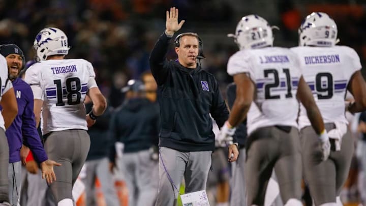 CHAMPAIGN, IL - NOVEMBER 25: Head coach Pat Fitzgerald of the Northwestern Wildcats celebrates with members of the team after a score against the Illinois Fighting Illini at Memorial Stadium on November 25, 2017 in Champaign, Illinois. (Photo by Michael Hickey/Getty Images)
